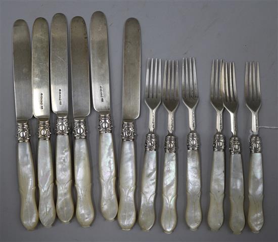 A set of six pairs of Victorian mother of pearl handled silver dessert eaters by John Gammage, Birmingham, 1862.